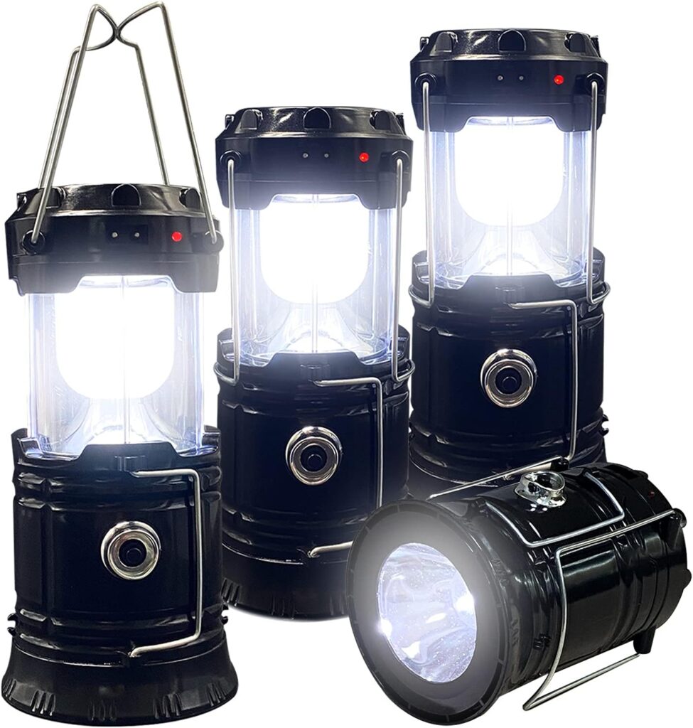Decorative solar lanterns hanging from tree branches at night.
