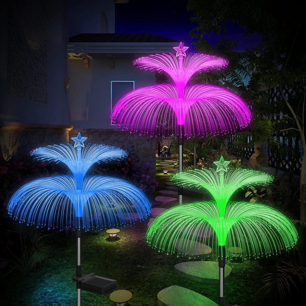 Colourful solar pathway lights glowing in a garden